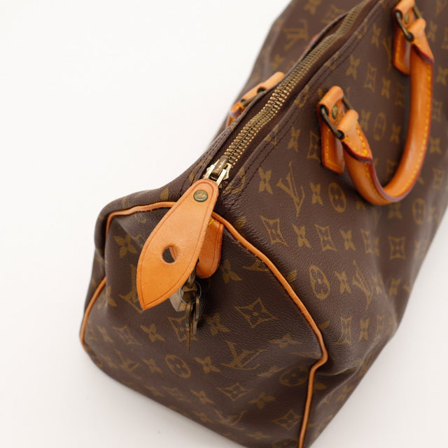 Détail tirette et languette cadenas Louis Vuitton Speedy 35 — AMANA Vintage