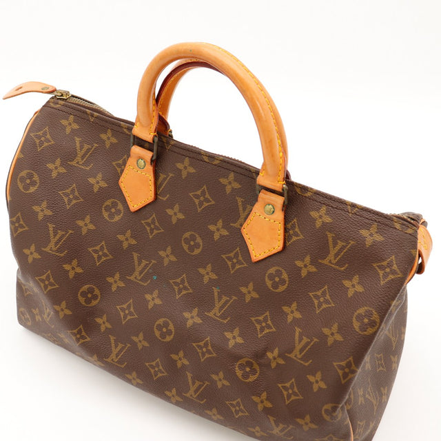 Vue trois-quarts anses Louis Vuitton Speedy 35 cuir vachette caramel — AMANA Vintage