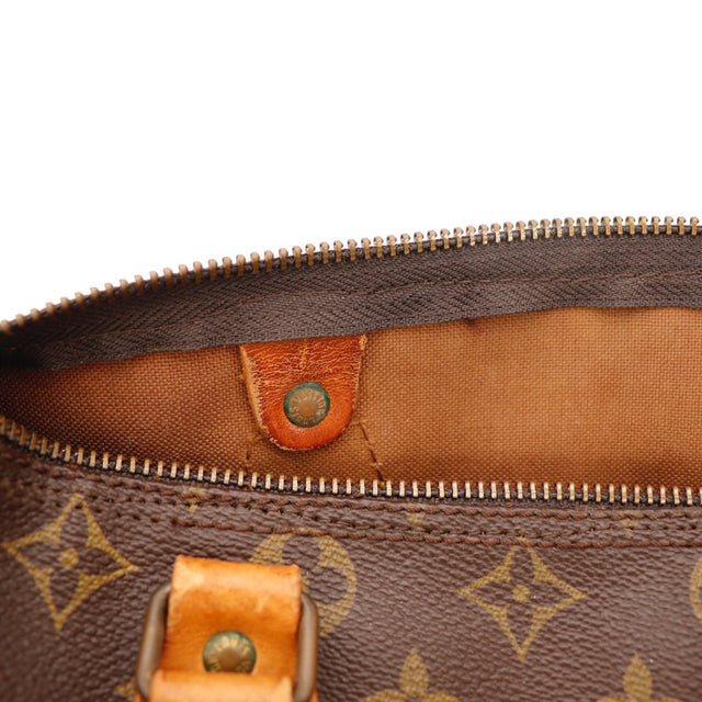 Détail du cuir vachette Louis Vuitton Speedy 25 Toile Monogramme occasion authentique — AMANA Vintage