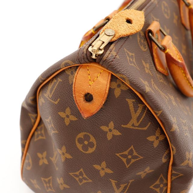 Détail anse et attaches Louis Vuitton Speedy 30 vachette caramel — AMANA Vintage