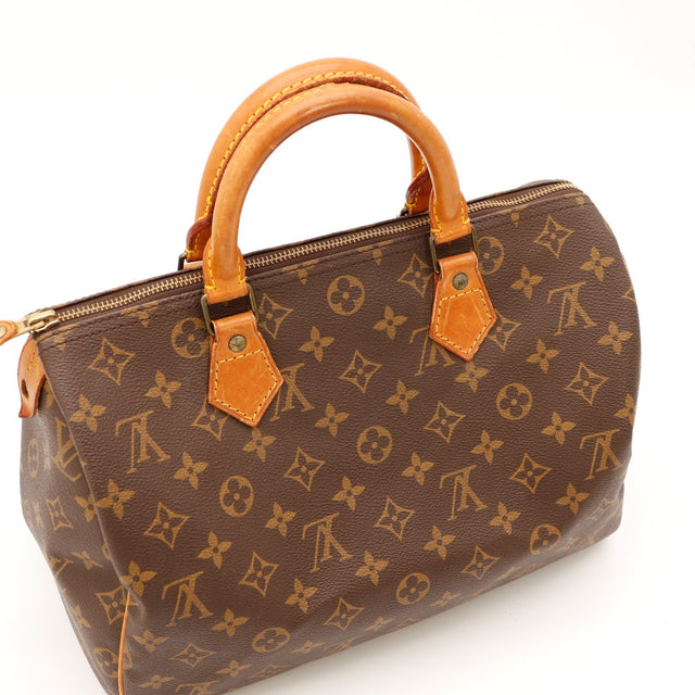 Détail coin droit Louis Vuitton Speedy 30 languette cadenas usure légère — AMANA Vintage