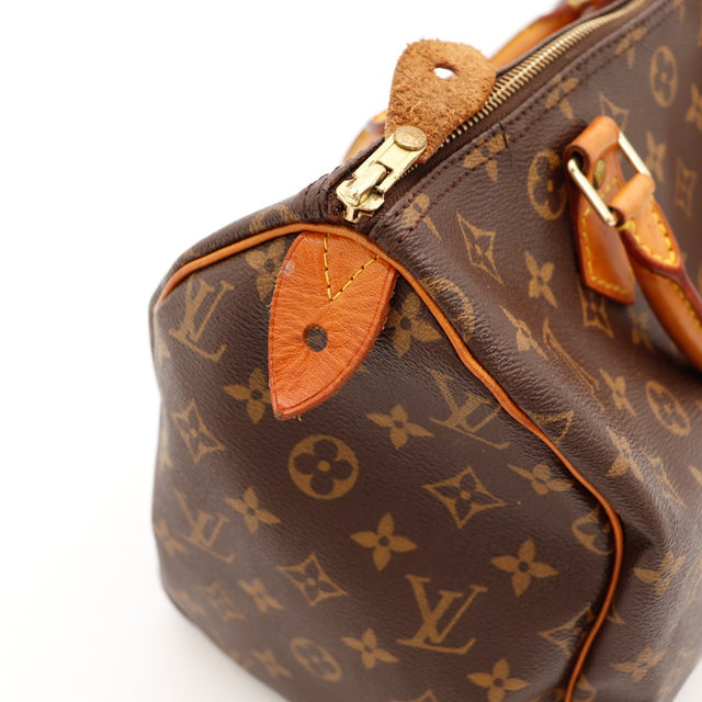 Vue trois quarts Louis Vuitton Speedy 30 anses vachette patine caramel — AMANA Vintage