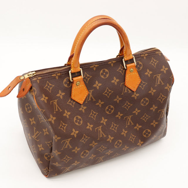 Détail anses vachette Louis Vuitton Speedy 30 patine caramel — AMANA Vintage