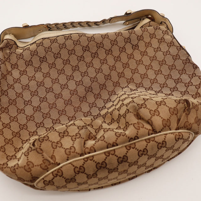 Détail coins bas Gucci Hobo Horsebit toile GG occasion authentique — AMANA Vintage