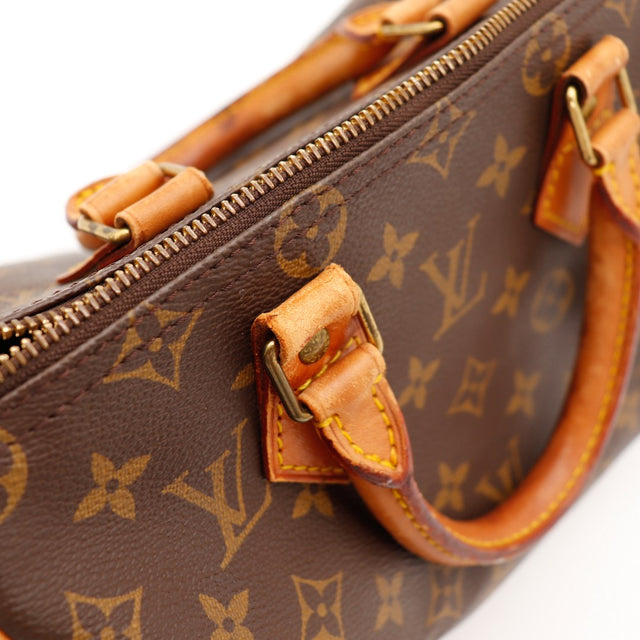 Détail attaches et boucles anses vachette Louis Vuitton Speedy 25 — AMANA Vintage
