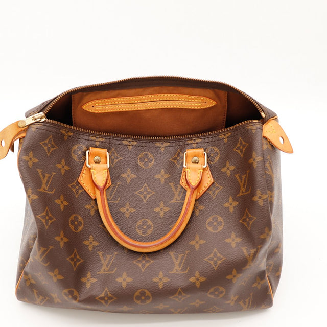 Détail intérieur Louis Vuitton Speedy 30 taches turquoise rivet poche date code SP1914 — AMANA Vintage