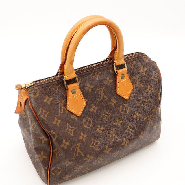 Vue trois quarts anses vachette Louis Vuitton Speedy 30 patine caramel — AMANA Vintage