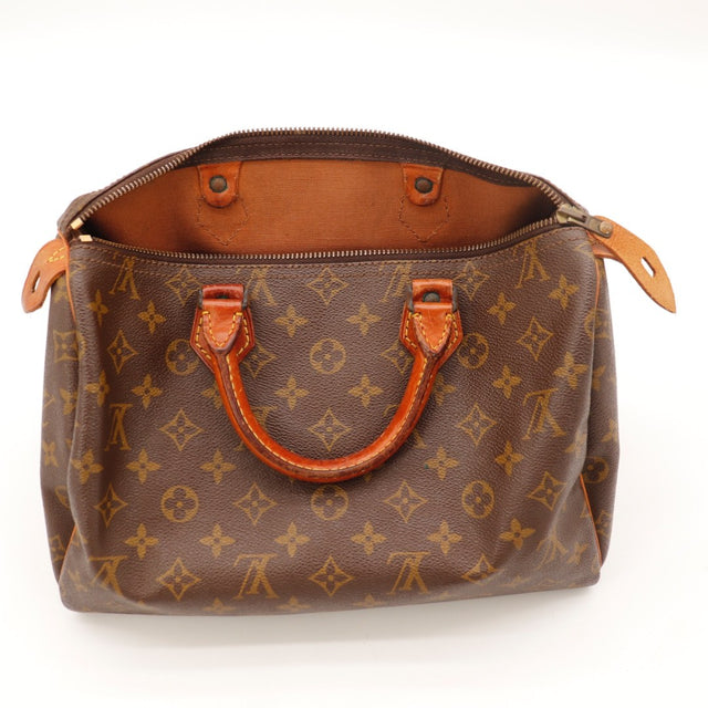 Détail des anses Louis Vuitton Speedy 30 Toile Monogramme et cuir vachette occasion authentique — AMANA Vintage
