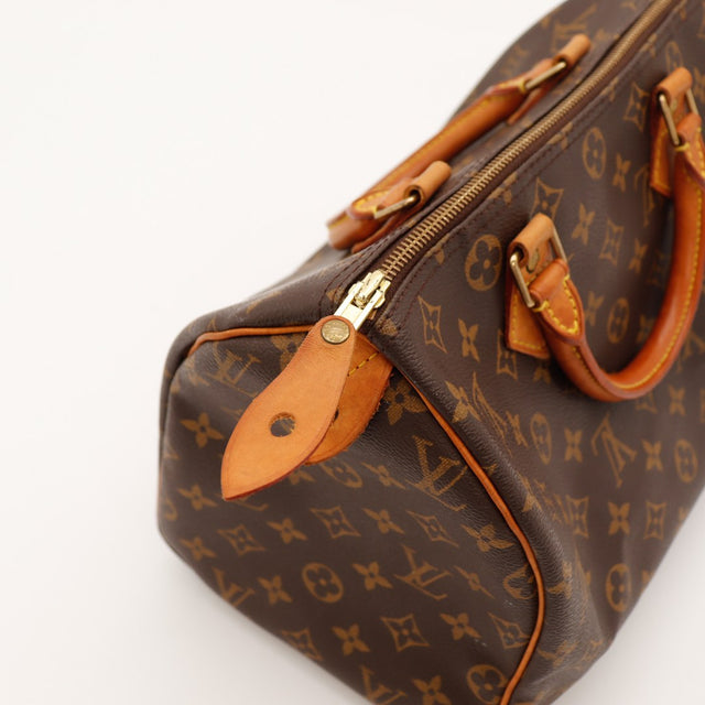 Détail tirette zip et languette cadenas vachette Louis Vuitton Speedy 30 — AMANA Vintage