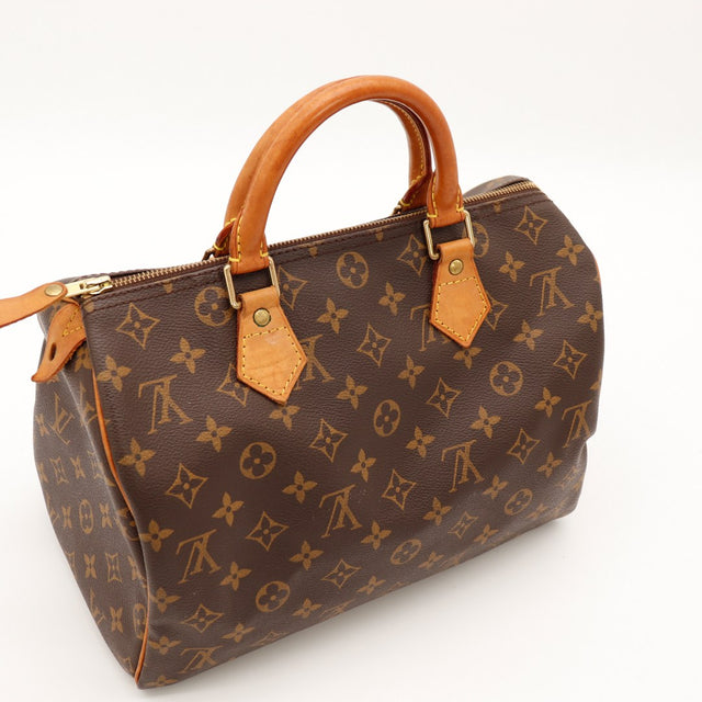 Vue trois-quarts Louis Vuitton Speedy 30 anses vachette patine caramel toile monogrammée — AMANA Vintage