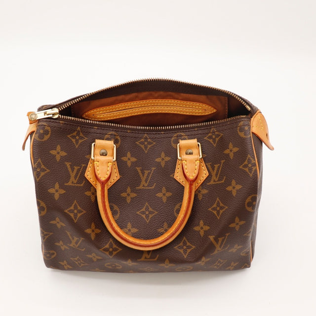 Détail des pattes de fixation Louis Vuitton Speedy 25 cuir vachette occasion authentique — AMANA Vintage