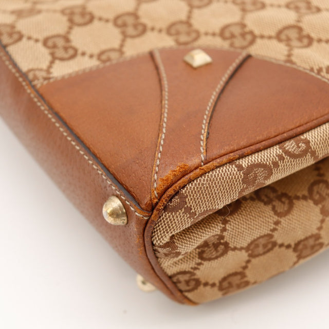 Detail coin inferieur Gucci New Jackie usure cuir canvas GG — AMANA Vintage