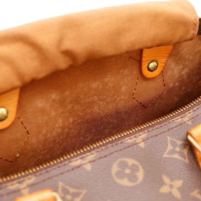 Détail tirette languette Louis Vuitton Speedy 30 cuir vachette occasion — AMANA Vintage