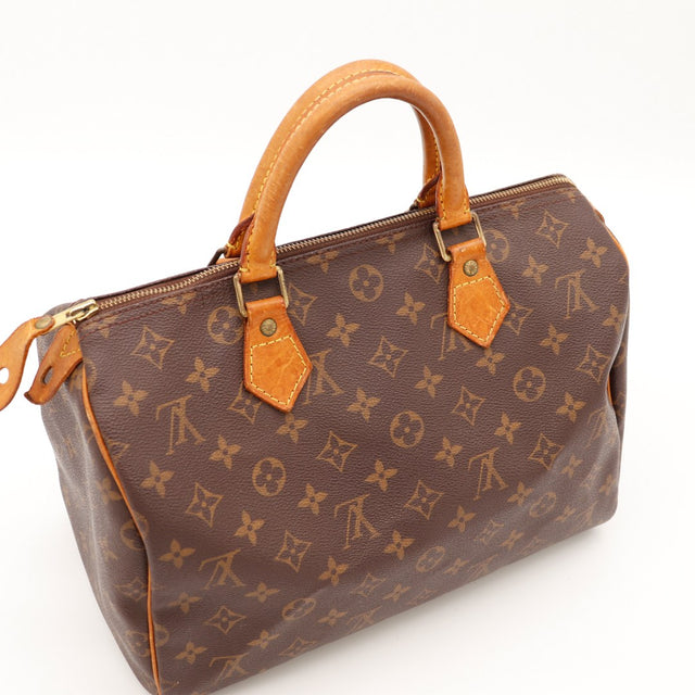 Détail languette zip Louis Vuitton Speedy 30 cuir vachette assombri — AMANA Vintage