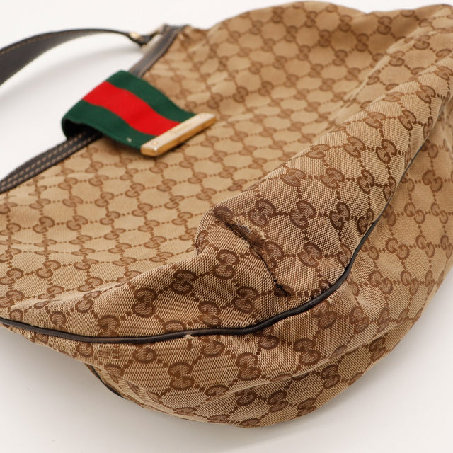 Détail coin inférieur Gucci Hobo Web déchirure canvas — AMANA Vintage