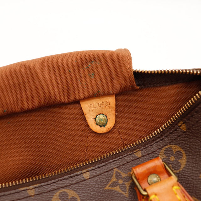 Détail tirette en cuir et zip Louis Vuitton Speedy 30 vachette caramel — AMANA Vintage