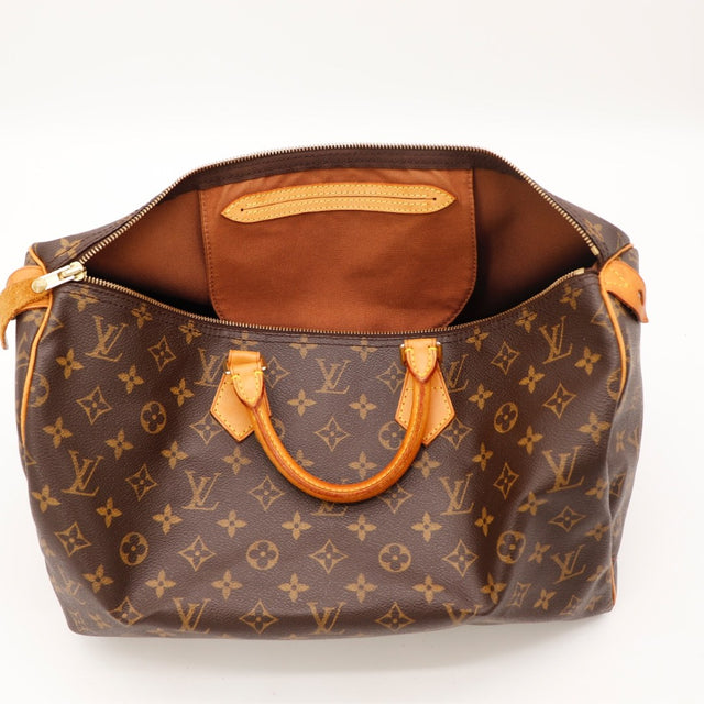 Détail des anses Louis Vuitton Speedy 35 cuir vachette occasion authentique — AMANA Vintage