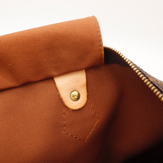 Détail des attaches d'anses Louis Vuitton Speedy 35 cuir vachette occasion authentique — AMANA Vintage