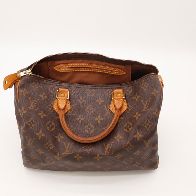 Vue des anses Louis Vuitton Speedy 30 cuir vachette occasion authentique — AMANA Vintage