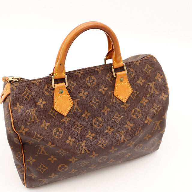 Louis Vuitton Speedy 30 vue trois quarts anses vachette patine caramel — AMANA Vintage