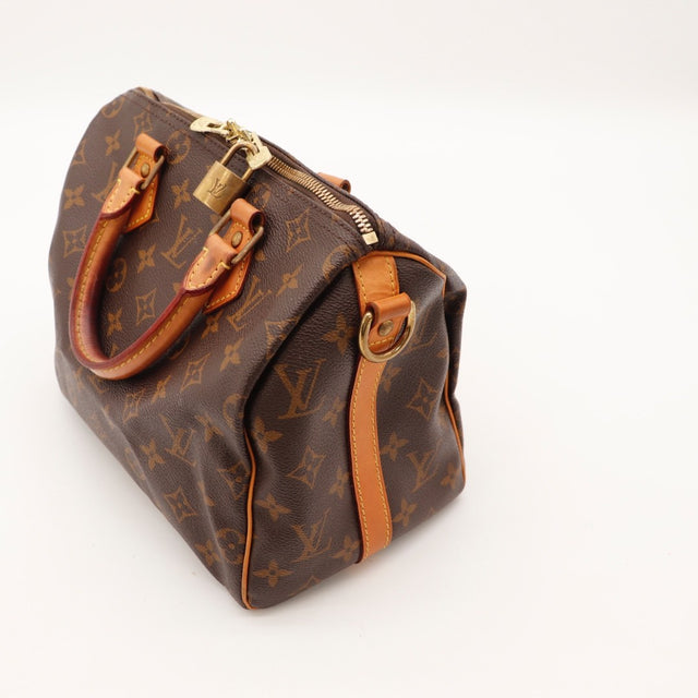 Détail de la fermeture Louis Vuitton Speedy Bandoulière 25 Toile Monogramme occasion authentique — AMANA Vintage