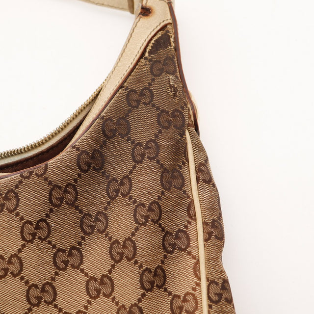 Detail canvas GG et zip Gucci Hobo beige occasion — AMANA Vintage