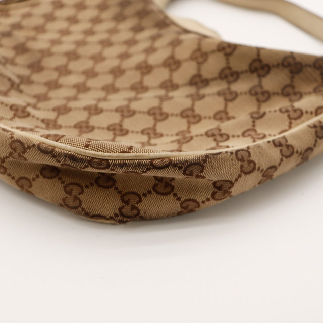 Detail fermoir pression Gucci Hobo GG beige occasion — AMANA Vintage