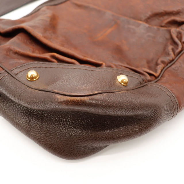 Détail coin inférieur Gucci Hobo Guccissima cuir marron — AMANA Vintage