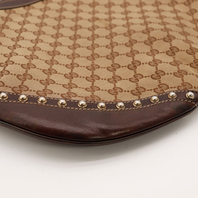 Detail coin inferieur Gucci Hobo Web cuir marron clous argentes occasion — AMANA Vintage