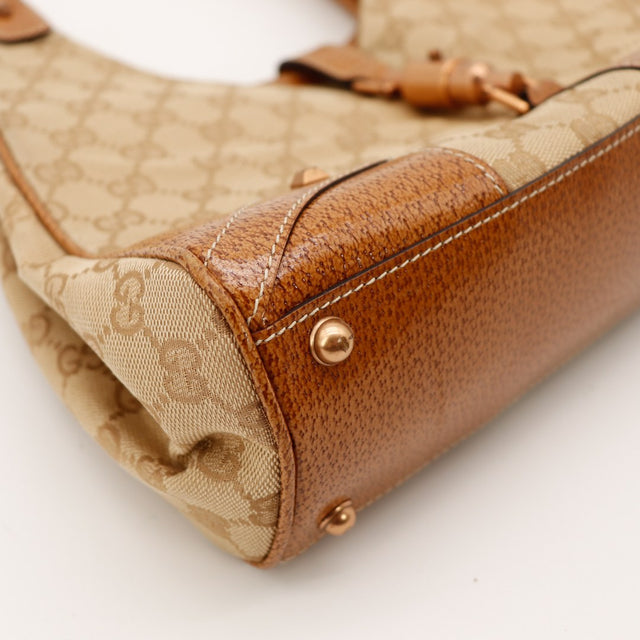Détail coin et fond Gucci New Jackie canvas GG beige marron occasion — AMANA Vintage