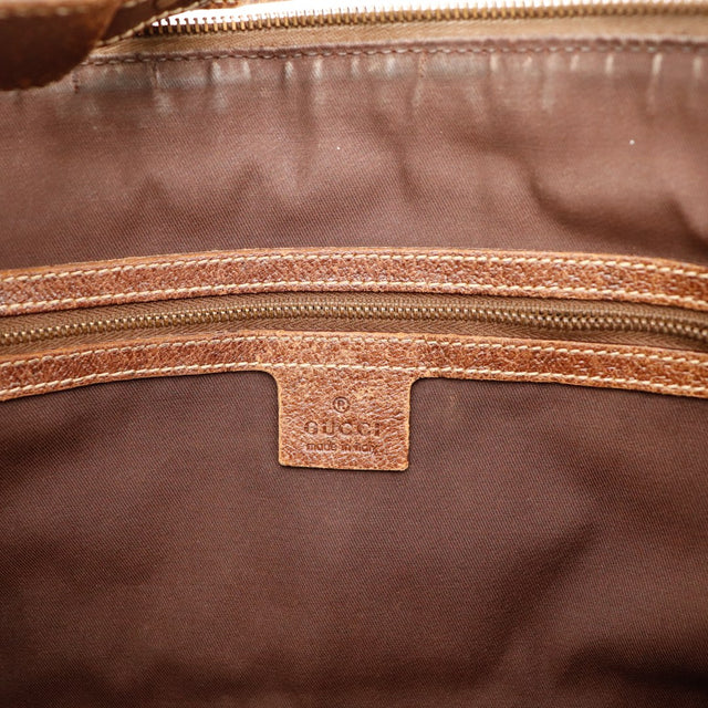 Detail interieur Gucci Hobo Web poche zippee cuir marron — AMANA Vintage