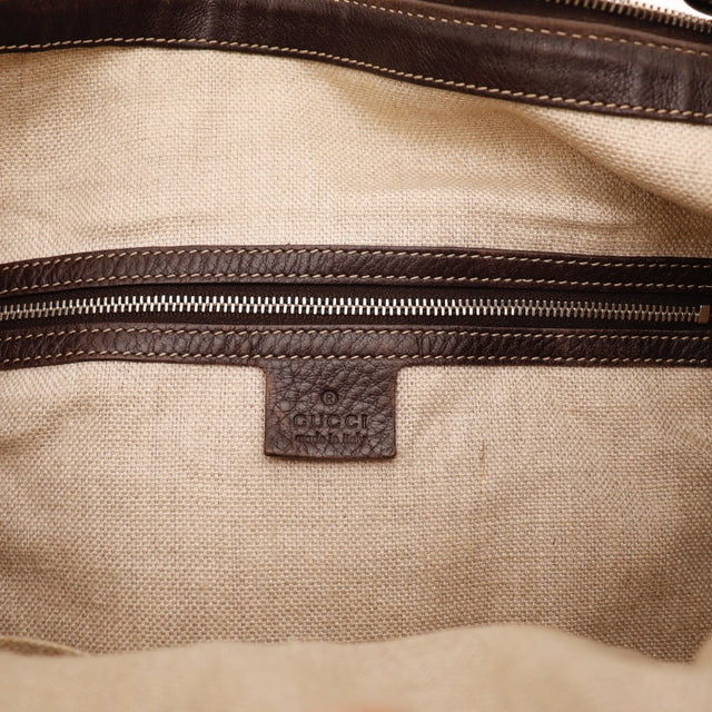 Détail tirette cuir marron Gucci Hobo — AMANA Vintage