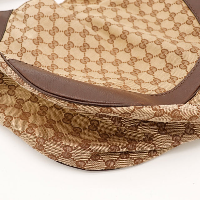 Detail coins cuir marron sac Gucci Hobo GG Canvas occasion — AMANA Vintage