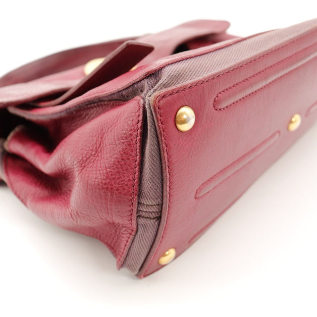 Détail coin inférieur sac Yves Saint Laurent Muse bordeaux usure toile — AMANA Vintage