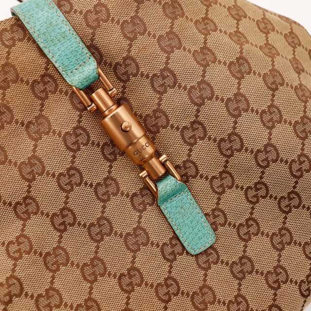 Détail fermeture à bascule Gucci New Jackie dorure bronze occasion — AMANA Vintage
