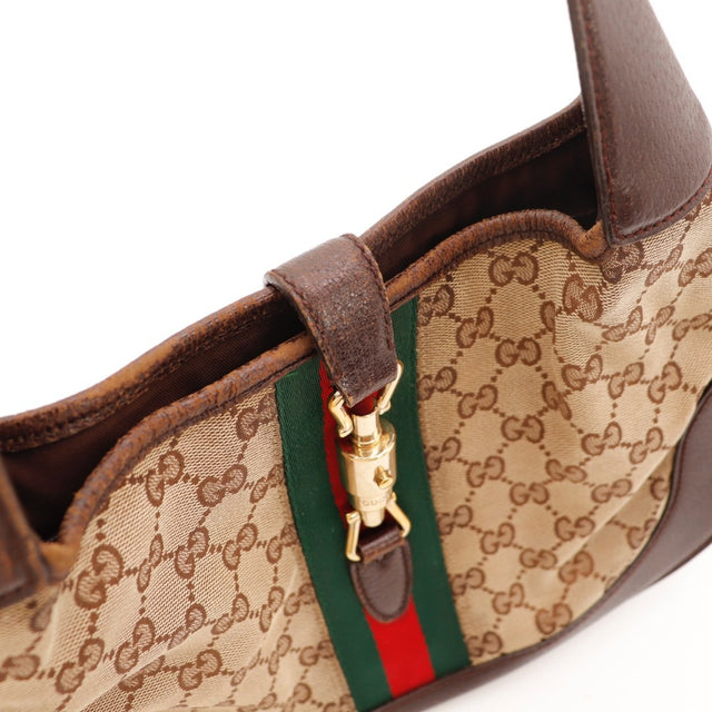 Détail des bordures Gucci Jackie toile monogrammée beige et ébène occasion authentique — AMANA Vintage