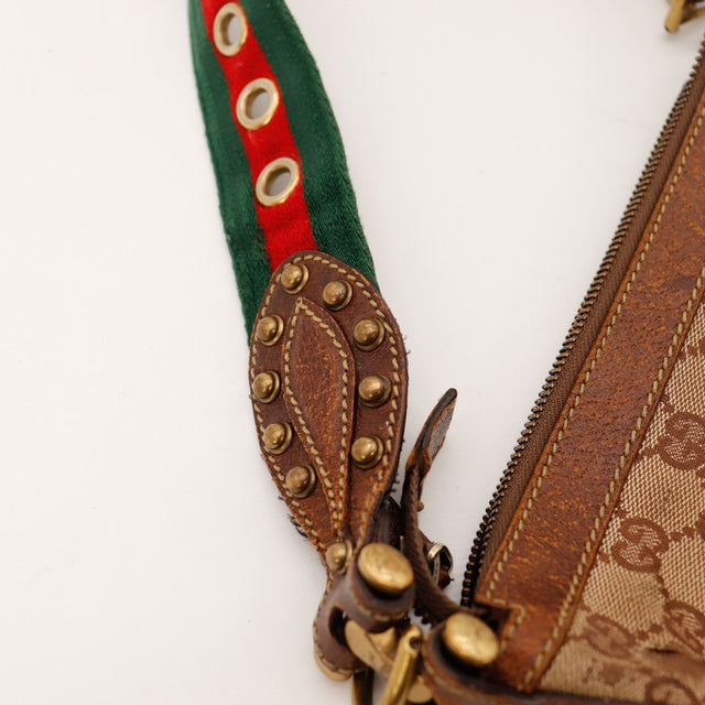 Détail sangle Web Gucci et fixation cuir clouté très usé — AMANA Vintage