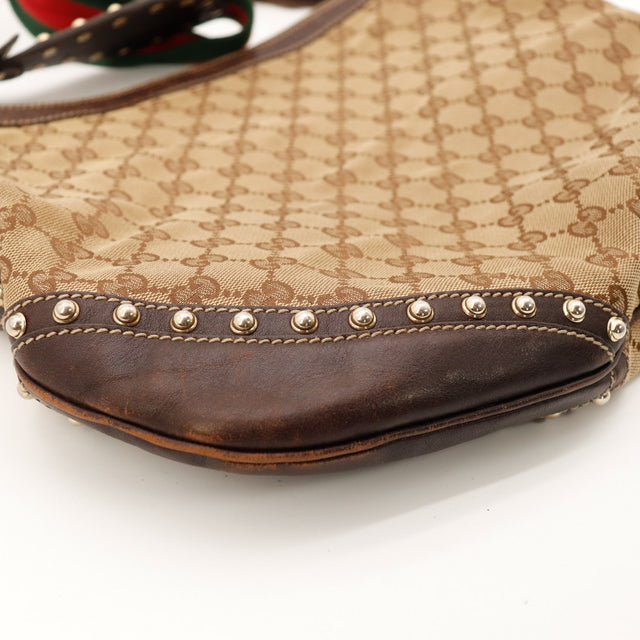 Détail coin inférieur gauche cuir Gucci Hobo Web usure occasion — AMANA Vintage