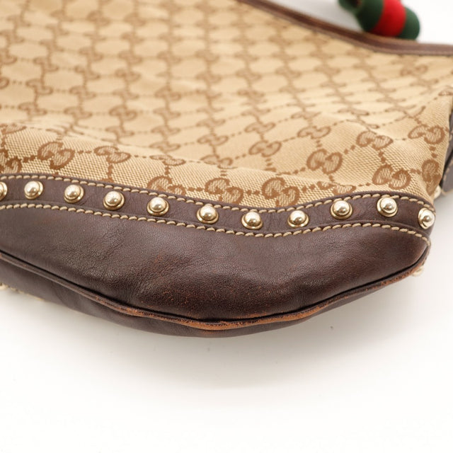 Détail coin inférieur droit cuir Gucci Hobo Web usure occasion — AMANA Vintage