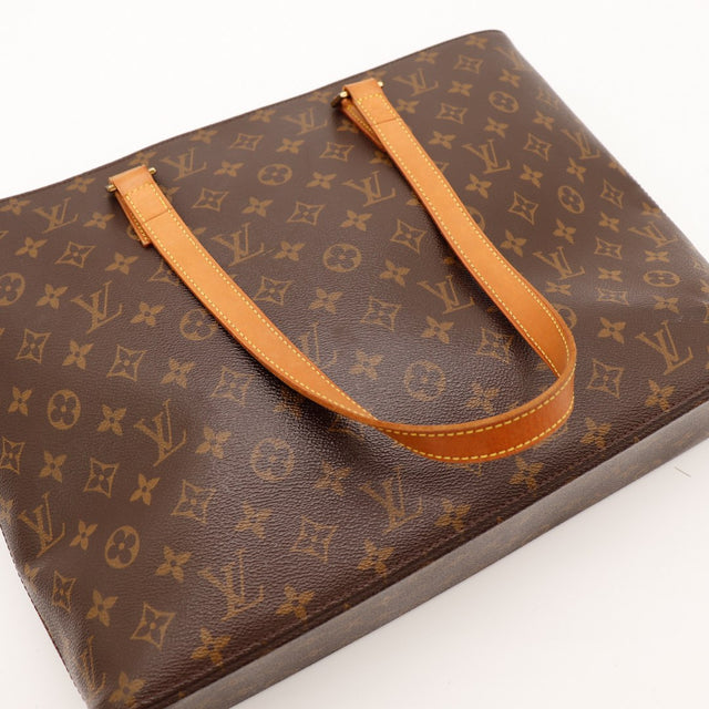 Détail anses vachette Louis Vuitton Luco patine caramel — AMANA Vintage