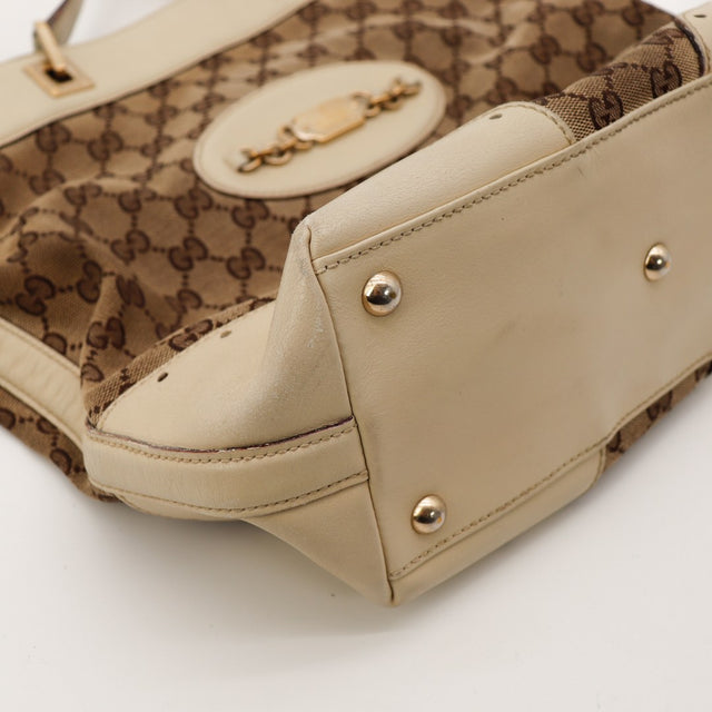 Detail coin inferieur Gucci Tote Horsebit cuir ivoire frottements — AMANA Vintage