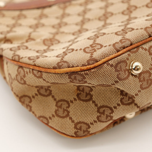 Détail coin inférieur Gucci Hobo Bambou légers frottements sur bordure cuir — AMANA Vintage