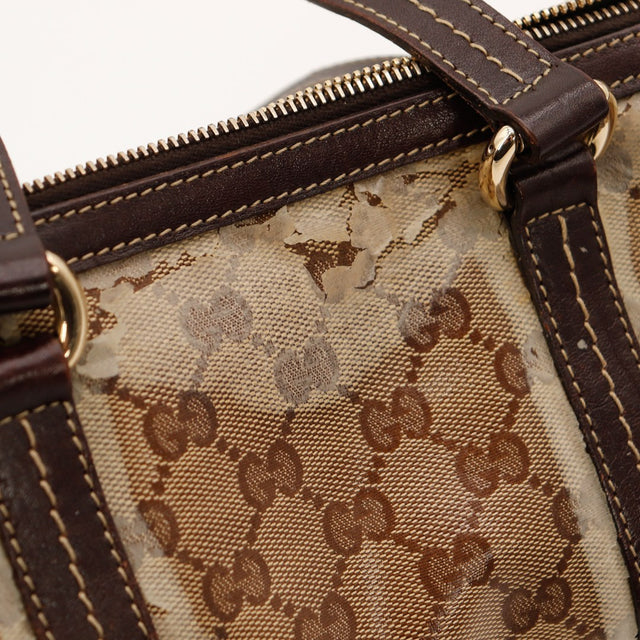 Détail anses cuir marron Gucci Boston occasion — AMANA Vintage