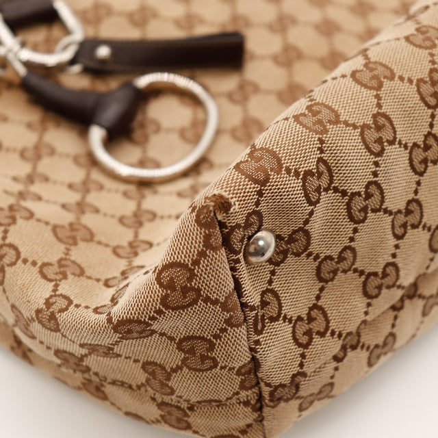 Détail coin inférieur Gucci Tote monogramme — AMANA Vintage