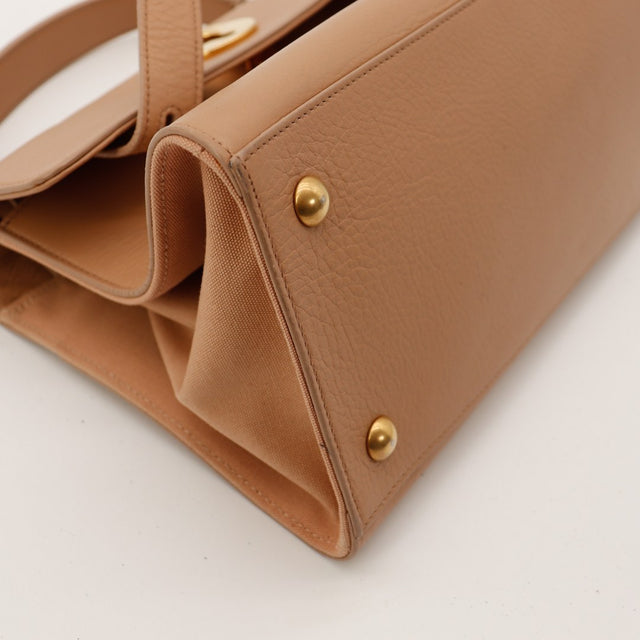 Détail coin supérieur Saint Laurent Muse avec taches et frottements visibles — AMANA Vintage