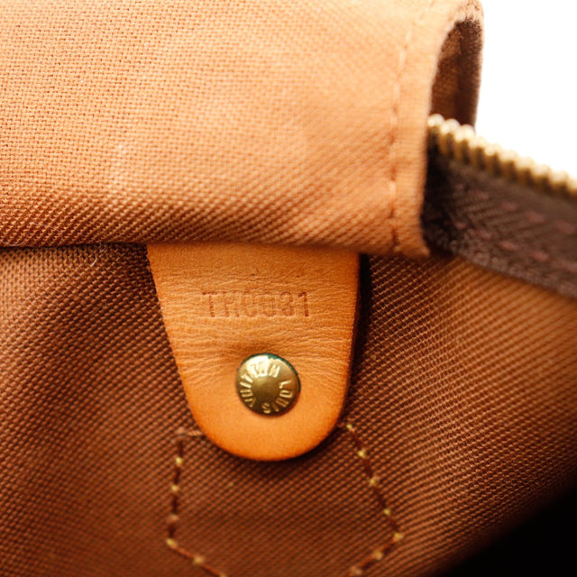 Detail anse attache vachette patine caramel Louis Vuitton Speedy 30 — AMANA Vintage