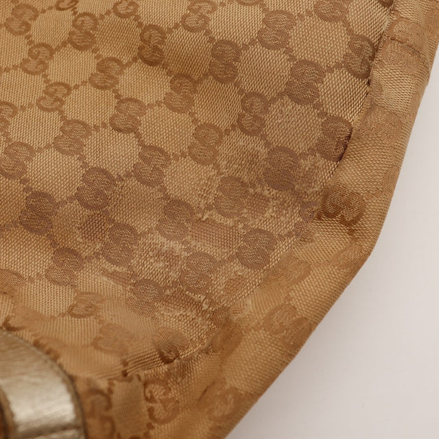 Détail coin inférieur toile monogrammée Gucci Hobo frottements — AMANA Vintage