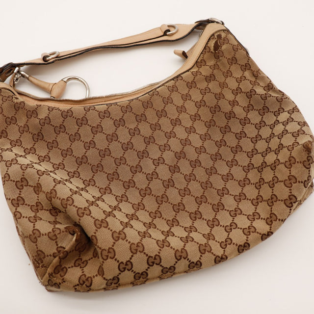 Hobo Gucci vue de dessus sac posé toile monogrammée — AMANA Vintage
