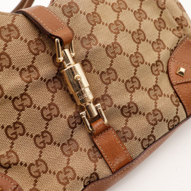 Détail fermoir Jackie doré Gucci New Jackie toile GG — AMANA Vintage