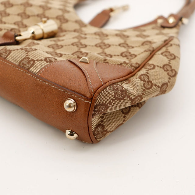 Détail coin Gucci New Jackie vue rapprochée cuir marron occasion — AMANA Vintage